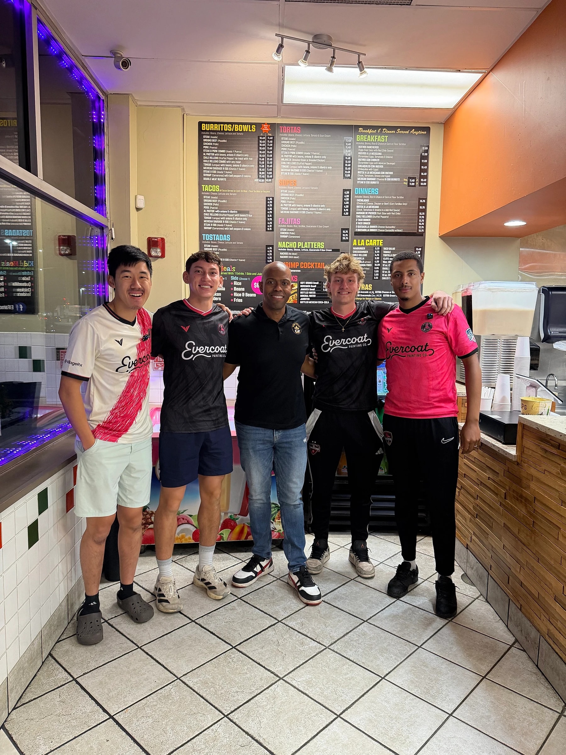 Wanderers players with the El Famous Burrito team at the counter